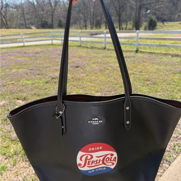 Coach Handbags - Coach Black Leather Tote with Red & Blue Pepsi-Cola Graphic